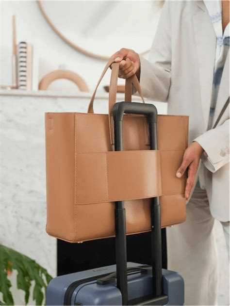 designer carry on bags|designer bag with trolley sleeve.